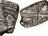two pieces of silver metal with a cross on it