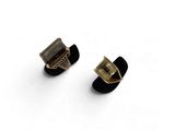 pair of black and gold stud earrings on white background