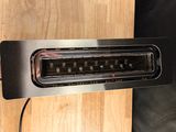 an image of a toaster on a wooden table