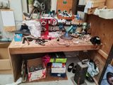 a cluttered workbench with many tools on it