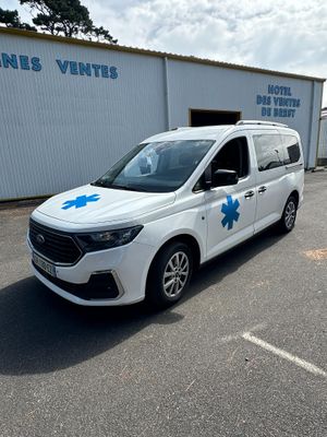a white van parked in front of a building with a blue star on the side