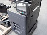 a printer sitting on top of a pallet in a warehouse