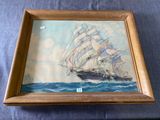 tableau représentant un voilier, dans un cadre en bois, monté sur une toile bleue