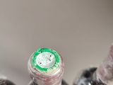 three wine bottles that are sitting next to each other