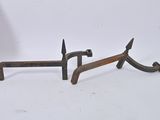 pair of antique iron and wood hammers on a white background