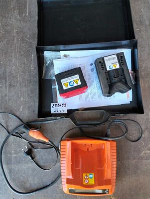 a box with a charger and a battery in it