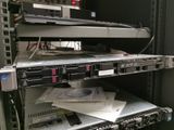 a rack with a bunch of electronic equipment on top of it