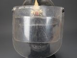 a close up of a helmet with a face shield on it