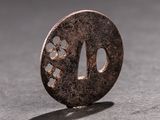 a small round metal object on a table