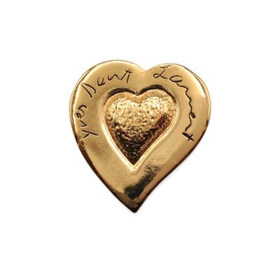 gold plated heart shaped charm with a message on it