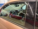 a car with a broken windshield and a broken window