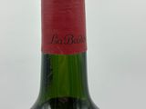 a bottle of wine that is sitting on a table