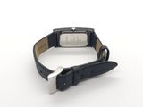 wrist watch on a white surface with a black strap