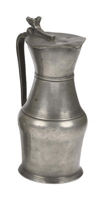 an old silver pitcher with a handle on a white background