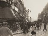 a black and white photo of a busy city street