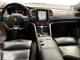 a picture of a car interior with a steering wheel and dashboard