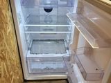 an open refrigerator with the door open in a kitchen
