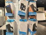 a lot of cell phones on display in a store