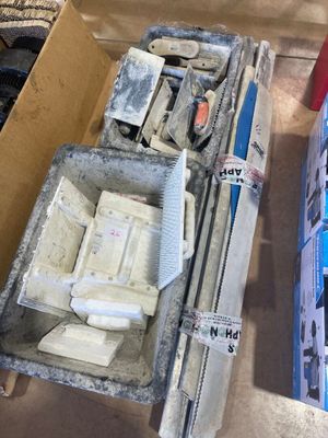 a box of tools sitting on the floor next to a box of tools