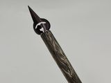 a close up of a pen with a metal tip on a white background
