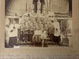 an old photo of a group of people posing for a picture