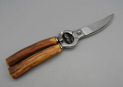 a knife with a wooden handle on a table