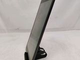 a tablet that is sitting on a stand on the table