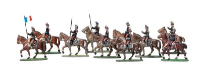 many figurines of men riding horses and holding flags