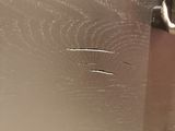 a close up of a door handle on a refrigerator