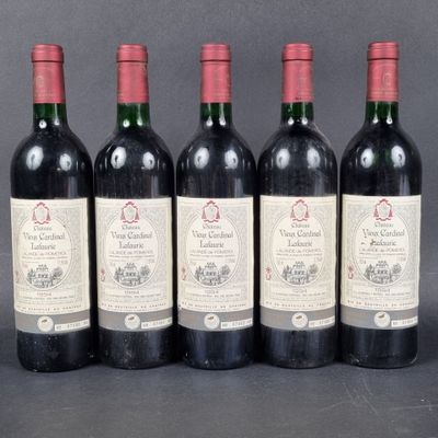 six bottles of wine are lined up in a row