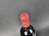 a bottle of wine that is sitting on a table