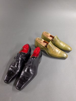 three pairs of shoes are lined up on a table