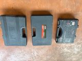 three cases that are sitting on the floor
