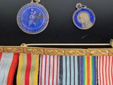 several medals and medals are displayed on a display case