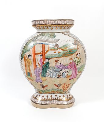 a vase with a painting on it sitting on a table
