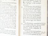 a person holding an open book in their hand