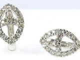 pair of diamond and white gold earrings and a ring