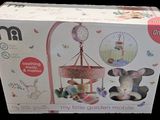 a box with a stuffed animal and a clock on it