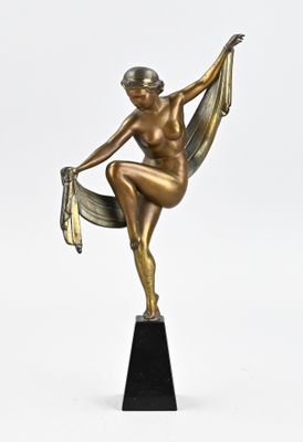 bronze statue of a woman sitting on a chair holding a book
