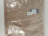 a bag of clothing that is wrapped in plastic