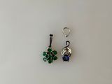 pair of green and blue crystal earrings on a white surface