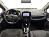 the interior of a small car with a steering wheel and dashboard
