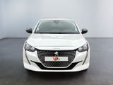 the front view of a white car in a white room
