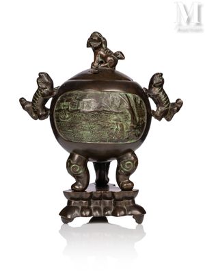 an image of a bronze vase with two birds on it