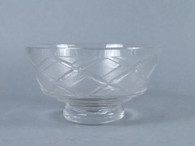 a glass bowl that is sitting on a table