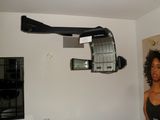 a hair dryer hanging from the ceiling in a room
