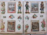 an open book with pictures of people and animals on it