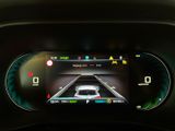 the dashboard of a car with a digital display in the center of it