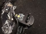 an image of a remote control and a charger on a table
