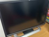 a television sitting on top of a wooden table